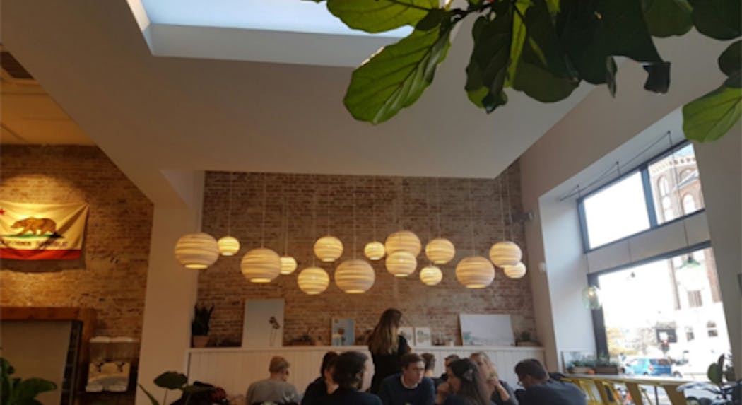 The LED lighting project at a California-themed restaurant in Denmark features CoeLux luminaires enabled with spatial tuning to mimic California daylight transitions.