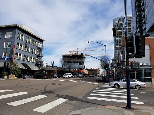 FIG. 1. San Diego is installing the Current CityIQ nodes on both cobrahead and decorative gaslamp-style poles with LED luminaires. The busy Market Street includes both types, and with two lanes of traffic in each direction and a turn lane, the sensor nodes with two-way cameras line both sides of the street. (Photo credits: All photos, Maury Wright.)