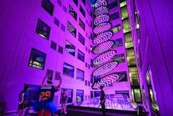 In the millennial-targeted Moxy hotel in San Diego’s Gaslamp Quarter, guestrooms surround a courtyard-like space where an LED-based architainment feature rises from the hotel lobby below through a glass ceiling, delivering dynamic shows conceived to evoke images such as a stream or waterfall. The dynamic RGB-LED-based system was created by Moment Factory and crafted by Digital Ambiance to be a “hero centerpiece fixture” to be enjoyed by guests. (Photo credit: J Street Hospitality.) In the millennial-targeted Moxy hotel in San Diego’s Gaslamp Quarter, guestrooms surround a courtyard-like space where an LED-based architainment feature rises from the hotel lobby below through a glass ceiling, delivering dynamic shows conceived to evoke images such as a stream or waterfall. The dynamic RGB-LED-based system was created by Moment Factory and crafted by Digital Ambiance to be a “hero centerpiece fixture” to be enjoyed by guests. (Photo credit: J Street Hospitality.)