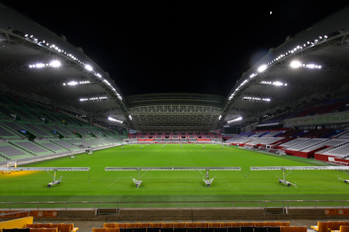 The new LED lights from Signify at Kobe Misaki stadium should help put the rugby action into a good light for 4K ultrahigh-definition broadcasts. The caged and wheeled LED grow lights in the foreground, which come from another lighting company, should also help the grass look green. (Photo credit: Image courtesy of Signify.)