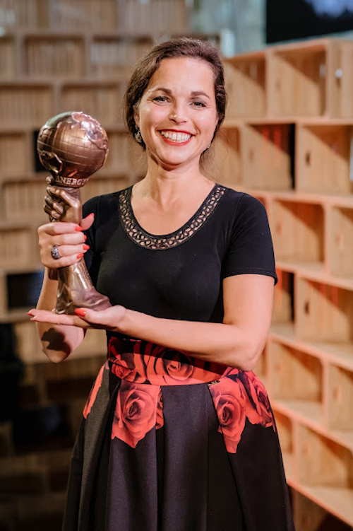 Mrs Vladykova accepting the award for best Town project