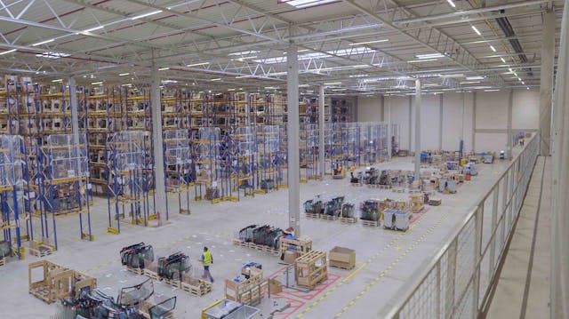 The Signify LED lighting system illuminates, gathers data, and analyzes it for this Pilkington Automotive warehouse in Gelsenkirchen, Germany. (Photo credit: Image courtesy of Signify.)
