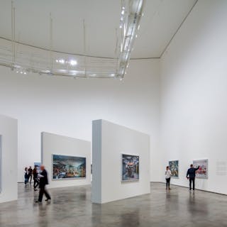 A single LED luminaire style provides projector, spotlight, and wall-wash effects in the Guggenheim Museum Bilbao, where Zumtobel considered and handled challenges such as tight beam distributions, high ceilings, and art preservation with its custom SSL fixture. (Photo credit: Image by Faruk Pinjo, courtesy of Zumtobel.)