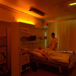 A stroke patient under soft warm nighttime lighting at Righospitalet, with neurologist Anders West of the University of Copenhagen. (Photo credit: Image courtesy of Chromaviso.)