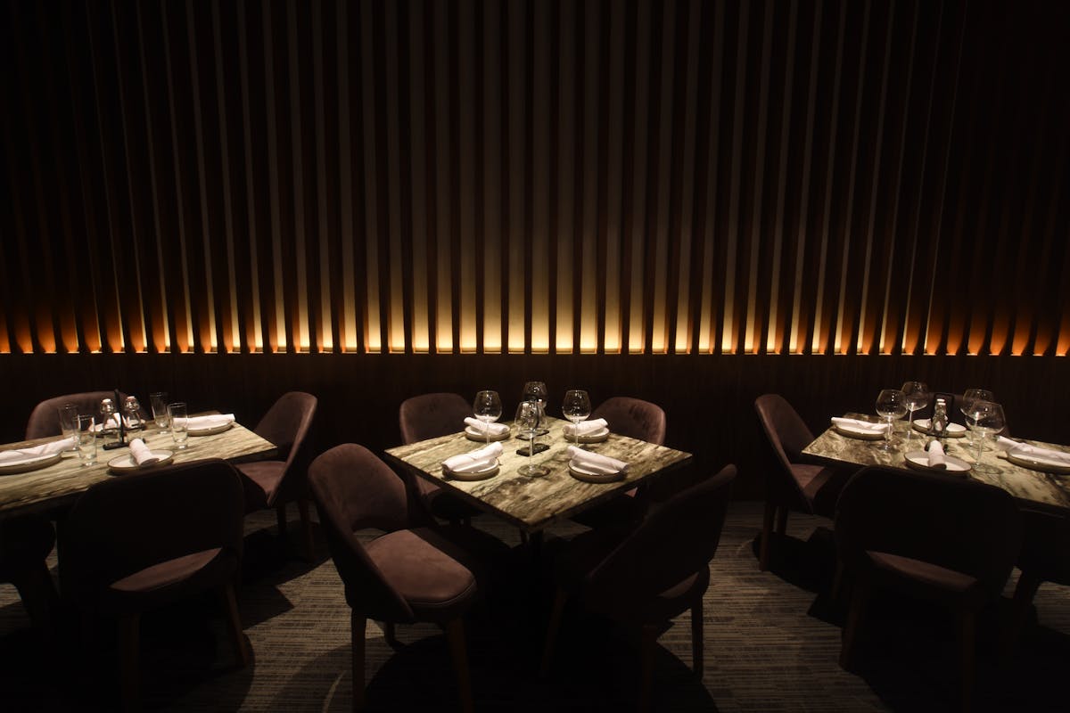 FIG. 3. Humans have long followed ingrained behavior of gathering around pools of light, and lighting design in a restaurant can play on this evolved behavior to encourage customers to comfortably spend a lengthy evening sharing a meal. (Photo credit: Image courtesy of Thomas Paterson, Lux Populi.)