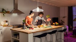 This modern couple will have an easier time eyeballing whether it’s quinoa or couscous in the bowl now that they have 1600 Hue lumens shining down. (Photo credit: Image courtesy of Signify.) This modern couple will have an easier time eyeballing whether it’s quinoa or couscous in the bowl now that they have 1600 Hue lumens shining down. (Photo credit: Image courtesy of Signify.)