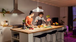 This modern couple will have an easier time eyeballing whether it&rsquo;s quinoa or couscous in the bowl now that they have 1600 Hue lumens shining down. (Photo credit: Image courtesy of Signify.)