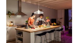 This modern couple will have an easier time eyeballing whether it&rsquo;s quinoa or couscous in the bowl now that they have 1600 Hue lumens shining down. (Photo credit: Image courtesy of Signify.)