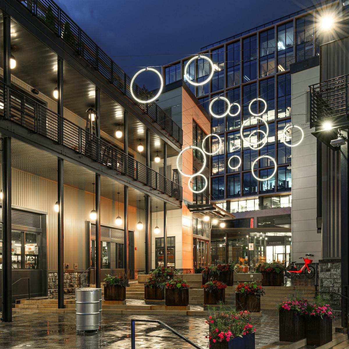 At The Wharf in Washington, DC, iLight&rsquo;s Plexineon LED rings create a unique yet useful feature of interest, conceived by Gilmore Lighting Design to bring more foot traffic to the entry plaza. (Photo credit: Image courtesy of iLight.)