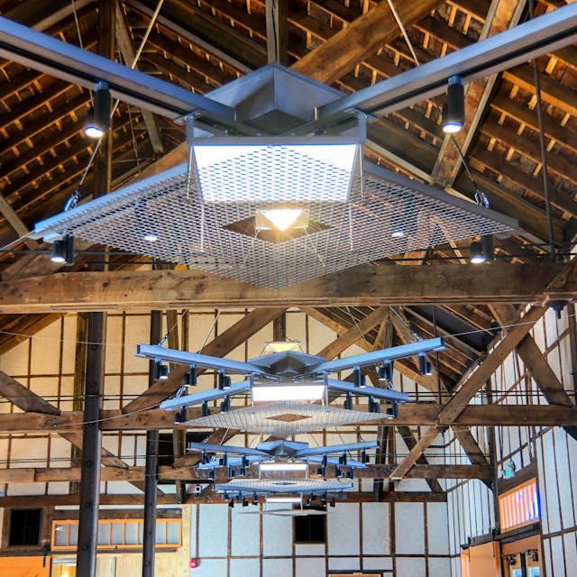 The custom usage of Albeo high-bay LED luminaires from GE Current aligns well with the historic former-freight-depot architecture in a modern update to the Freight events venue in Colorado&rsquo;s Rocky Mountains. (Photo credit: Image courtesy of GE Current, a Daintree company.)