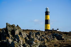 To LED or not to LED is a &ldquo;looming&rdquo; question at the St. John&rsquo;s Point Lighthouse on the Northern Ireland coast. (Photo credit: Image courtesy of Philip McErlean via Flickr; used under CC BY-ND 2.0 &ndash; license details at https://bit.ly/30vEqKa.)