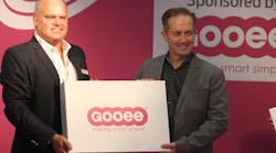 Gooee managing director Neil Salt (right) has long been a tireless advocate of the IoT. Here he is handing out Gooee development kits back in 2016 at London&rsquo;s LuxLive exhibition, before Gooee&rsquo;s focus changed. With him is Jan Kemeling, Gooee&rsquo;s former chief commercial officer, who left the company in January. (Photo credit: Image courtesy of Mark Halper.)