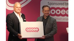 Gooee managing director Neil Salt (right) has long been a tireless advocate of the IoT. Here he is handing out Gooee development kits back in 2016 at London&rsquo;s LuxLive exhibition, before Gooee&rsquo;s focus changed. With him is Jan Kemeling, Gooee&rsquo;s former chief commercial officer, who left the company in January. (Photo credit: Image courtesy of Mark Halper.)