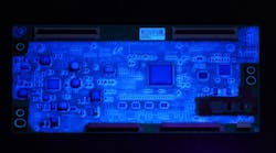DOWSIL&trade; CC-2588 Conformal Coating is a tough, abrasion-resistant silicone-based material that resists harsh environments and balances sustainability with productivity. DOWSIL&trade; CC-2588 illuminates under UV lamp. (Photo credit: Image courtesy of Dow.)