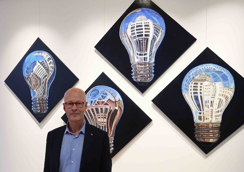 Now is the time to fully embrace light for wellbeing, says Good Light Group chairman Jan Denneman, pictured here in front of his own artwork.