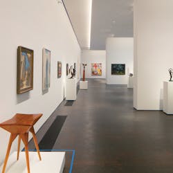 A single row of QuarkStar Q-Wall fixtures uniformly illuminates the 16-foot-tall walls of MFA Houston&rsquo;s Kinder Building. Q-Wall is the first commercial luminaire to provide mixed light immediately as it exits the beam-shaping optic, offering museum-grade lighting that scales to commercial or residential environments.