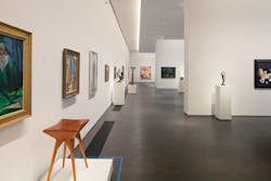 A single row of QuarkStar Q-Wall fixtures uniformly illuminates the 16-foot-tall walls of MFA Houston&rsquo;s Kinder Building. Q-Wall is the first commercial luminaire to provide mixed light immediately as it exits the beam-shaping optic, offering museum-grade lighting that scales to commercial or residential environments.