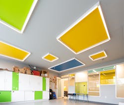 Axis Lighting&rsquo;s Stencil Forms luminaires create an engaging and whimsical border around colorful ceiling shapes echoed throughout the design of the art room&rsquo;s furnishings and interior windows.