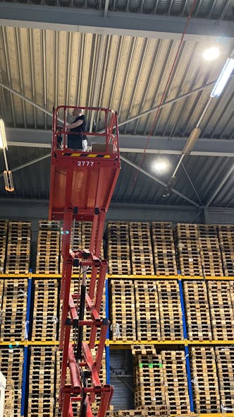 Technicians install wireless controls connected via the Cosmicnode system at a warehouse in the Netherlands.