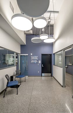 Circular pendants in varying sizes adorn the facility lobby with understated contemporary style. Circular pendants in varying sizes adorn the facility lobby with understated contemporary style.