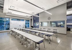 Slot 2 rectilinear pendants by Mark Architectural Lighting provide comfortable, diffuse light with a minimalist aesthetic in the conference room. Slot 2 rectilinear pendants by Mark Architectural Lighting provide comfortable, diffuse light with a minimalist aesthetic in the conference room.