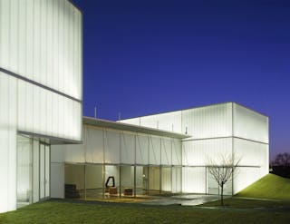 The exterior of the Nelson Atkins museum, Kansas City, glows without any visible light sources.