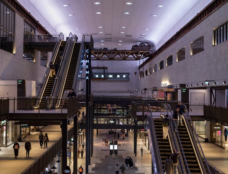 Former turbine halls emphasize the &apos;buzzing, hivelike aesthetic&apos; of the station&apos;s original architecture, said lighting designer Clementine Fletcher-Smith, with overhead and wall-grazing illumination designed for visual comfort by supporting contrast between light and dark areas.