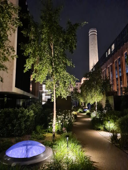 Low-wattage lighting shines on the walkways throughout the rooftop garden accessible to villa residents.