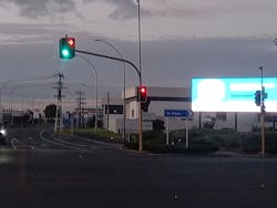 FIG. 1. In Hamilton, New Zealand, a digital billboard located close to an intersection with display colors similar to traffic signals could interfere with drivers’ attention and reaction time. FIG. 1. In Hamilton, New Zealand, a digital billboard located close to an intersection with display colors similar to traffic signals could interfere with drivers’ attention and reaction time.