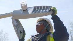 A technician converts the city's previous HPS lighting to LED luminaires specified by Ameresco. A technician converts the city's previous HPS lighting to LED luminaires specified by Ameresco.