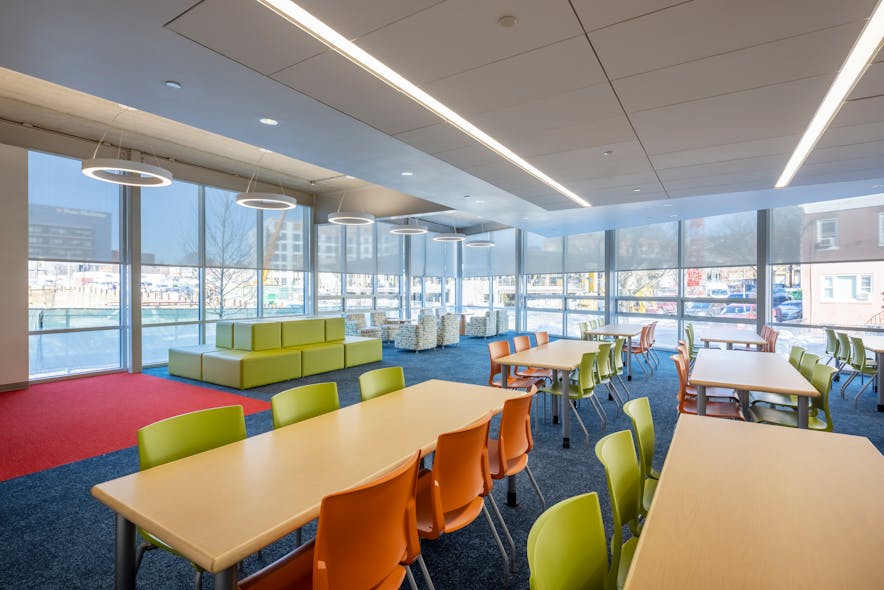Collaborative spaces: Form meets function in collaborative learning environments. The lighting provides functional illumination for writing surfaces and is balanced with access to daylight, creating a space supportive of teachers&apos;, students&apos;, and facilities workers&apos; needs.