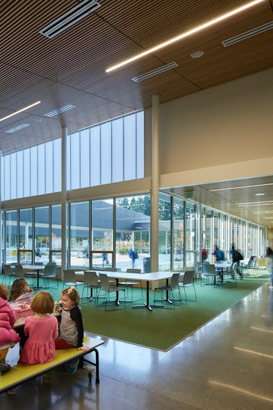 Linear luminaires balance with daylighting at Madrona School.