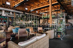 The design team from Shea, Inc. selected light fixtures that would complement the high ceilings and exposed beams in the historic warehouse space that was converted into a restaurant and distillery. The design team from Shea, Inc. selected light fixtures that would complement the high ceilings and exposed beams in the historic warehouse space that was converted into a restaurant and distillery.